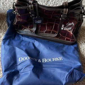 Dooney and Bourke purse looks new.